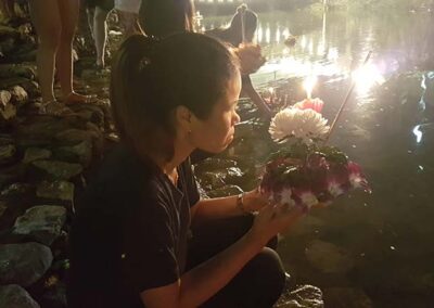Bussaba from Bussaba Massage in Khao Lak preparing to float a krathong down the river.